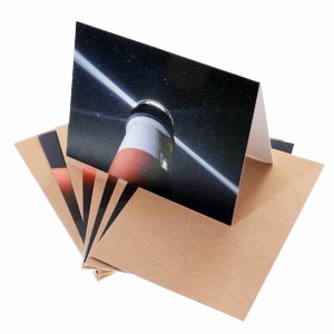 Note cards with the beacon of Sankaty Light house against the Milky Way