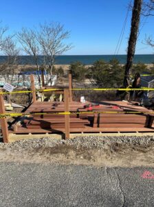 boards and other materials for construction of stairs leading to beach.